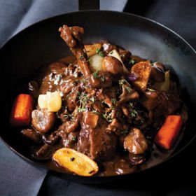 Duck “au vin” with chestnuts, onions and mushrooms